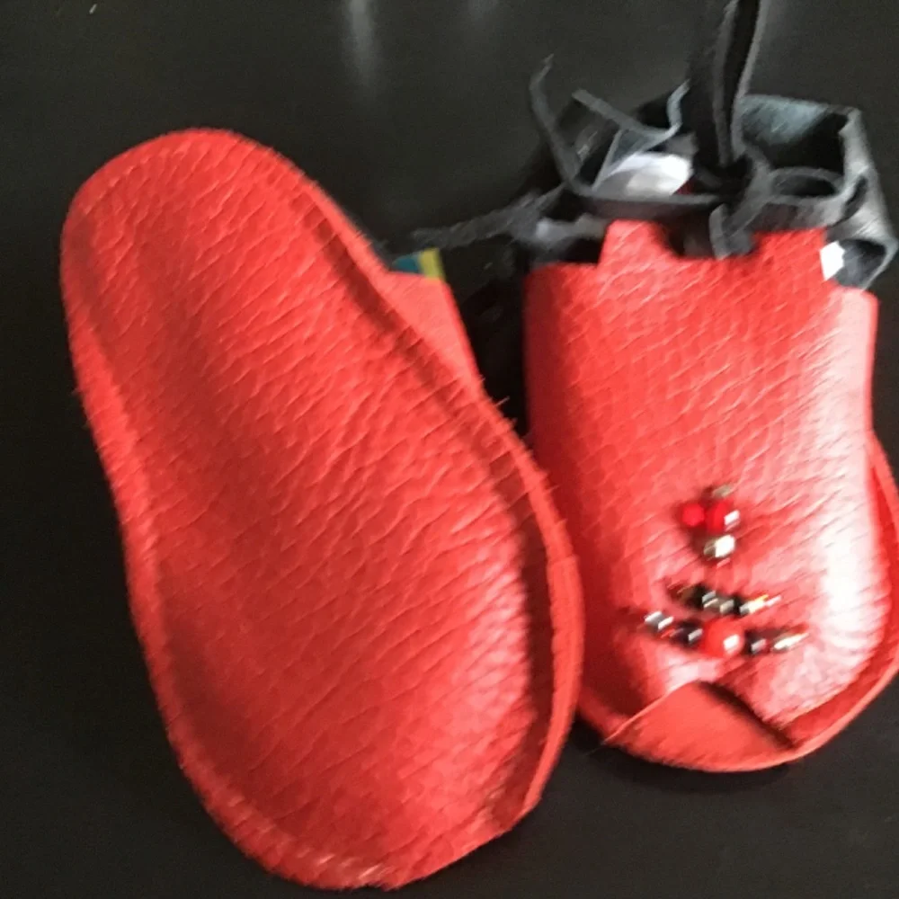 The sweetest TAOS baby Mocs..red and black..new with tags. Butter soft leather.